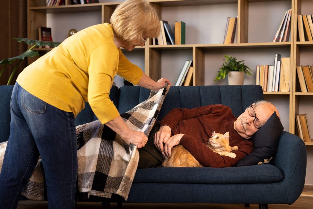 Senior resident being covered with a blanket