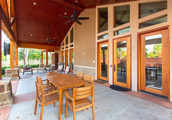 Outdoor patio area with a dining table and chairs.
