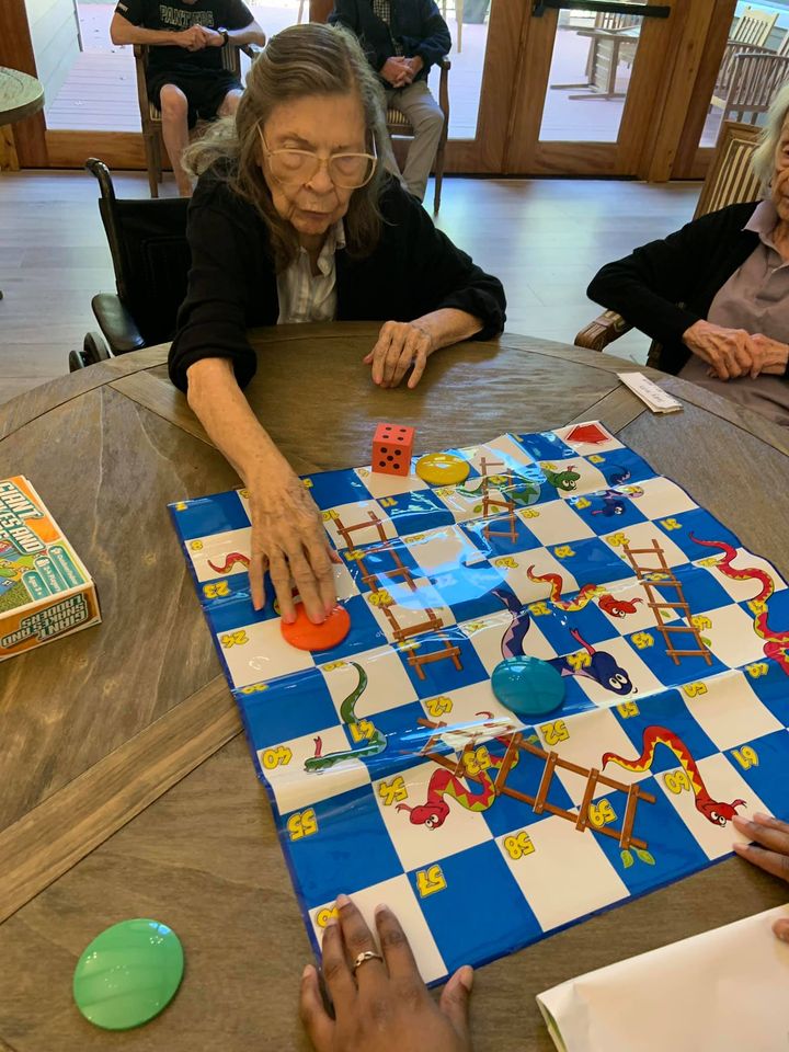 Residents playing a board game together