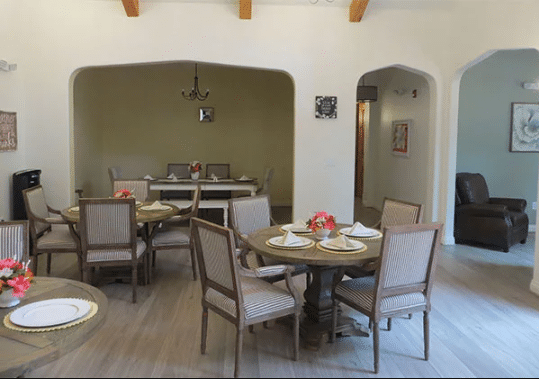 Dining area with tables and floral centerpieces