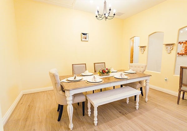 Well-set dining room with a large table