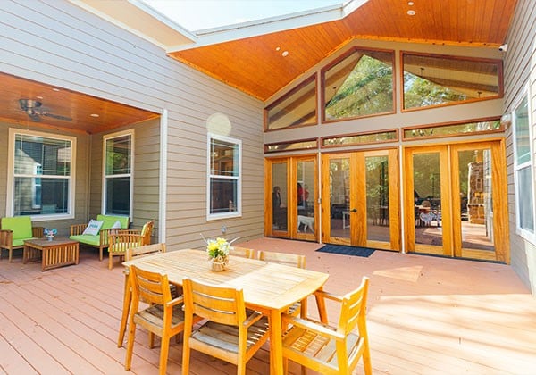 Outdoor patio area with dining table and seating