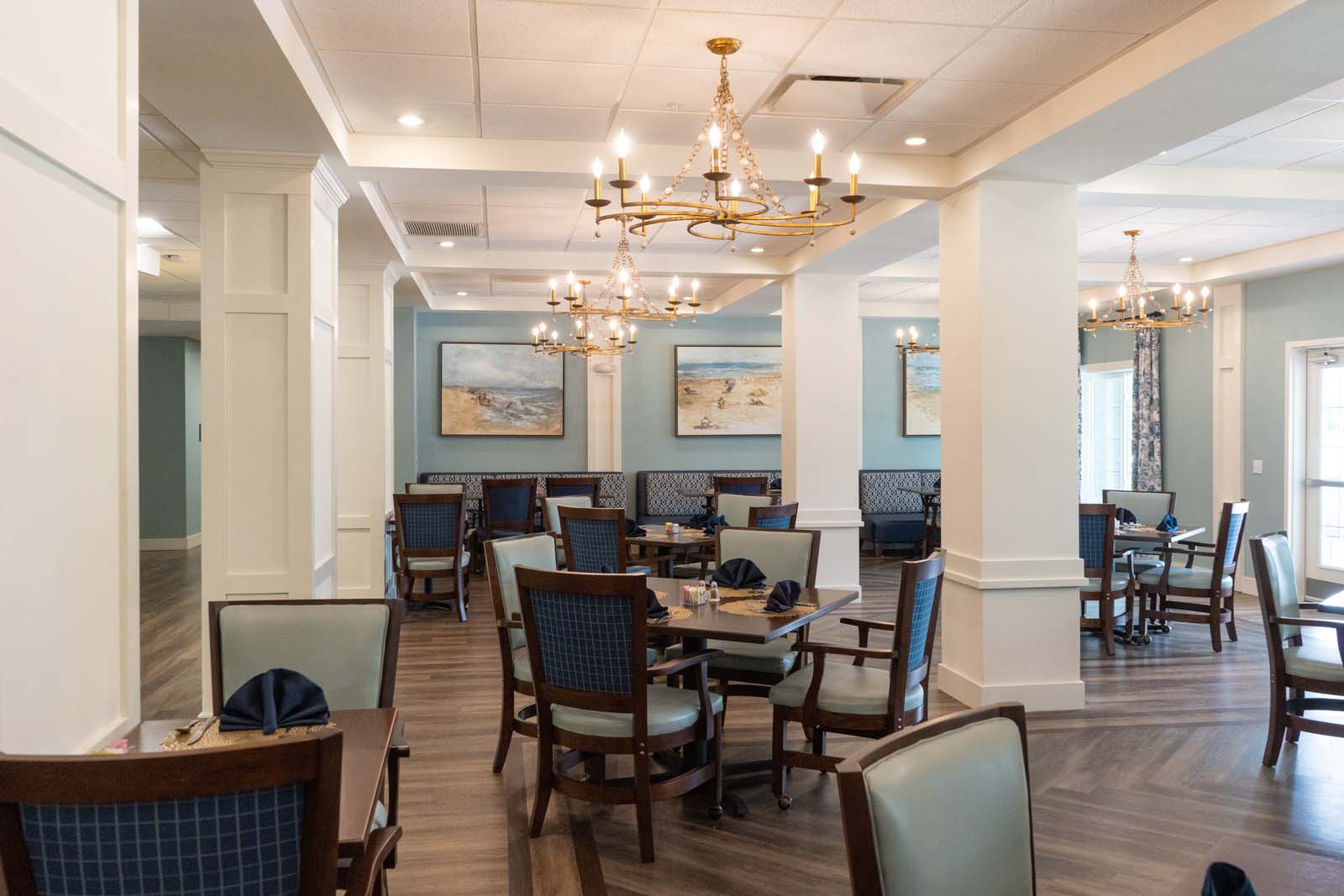 Dining room with tables and chairs set up for meals