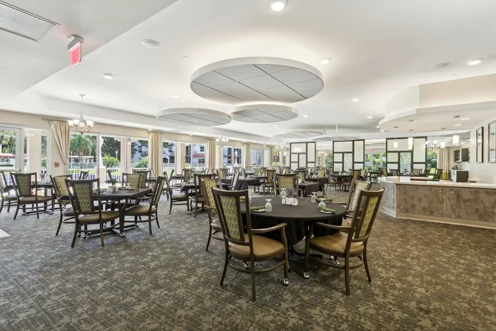 Dining area with tables and chairs set for meals