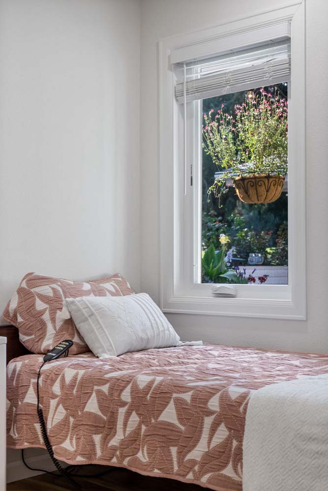 Cozy bedroom with window and plant view