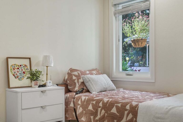 Cozy private resident room with bed and window