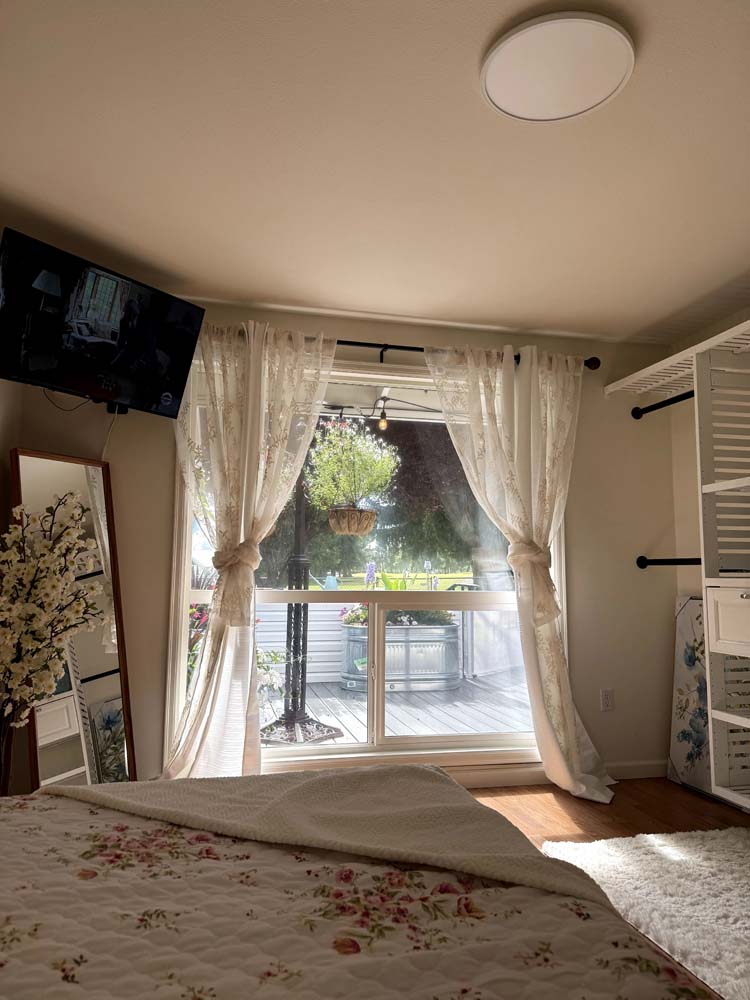 Bright bedroom with a view of the outdoor patio