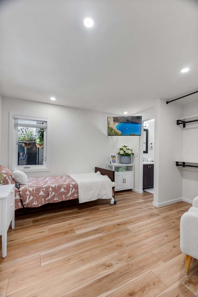 Interior view of a private resident room with natural light