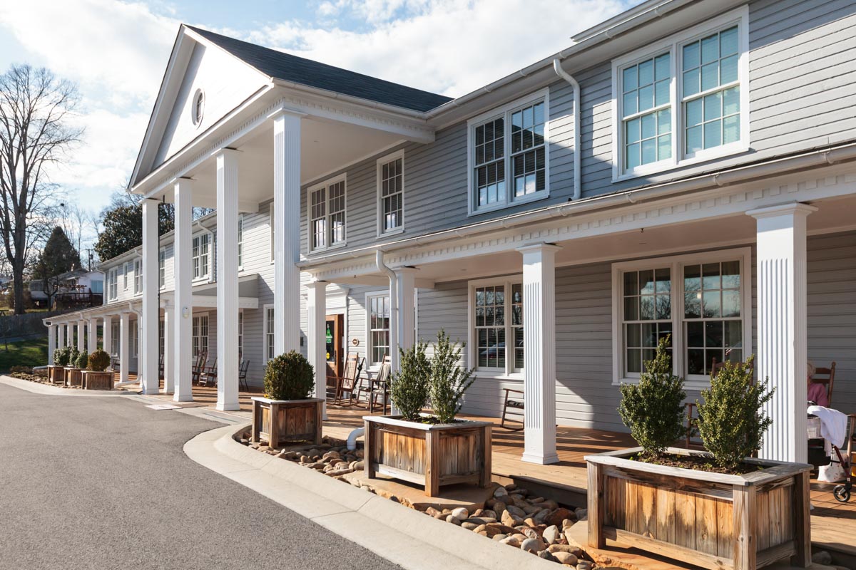 Exterior view of Azalea Estates of Monroe with porch seating
