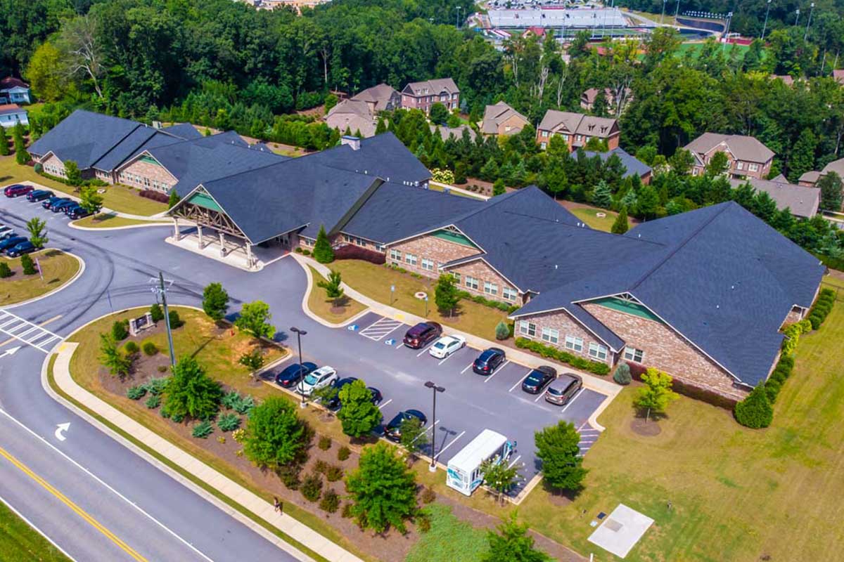 Aerial view of the facility buildings and parking lot