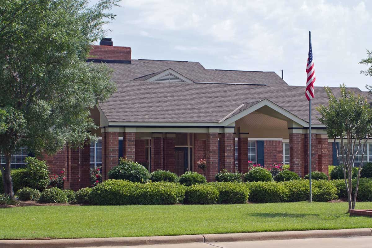 Exterior view of Azalea Estates of Monroe with landscaping