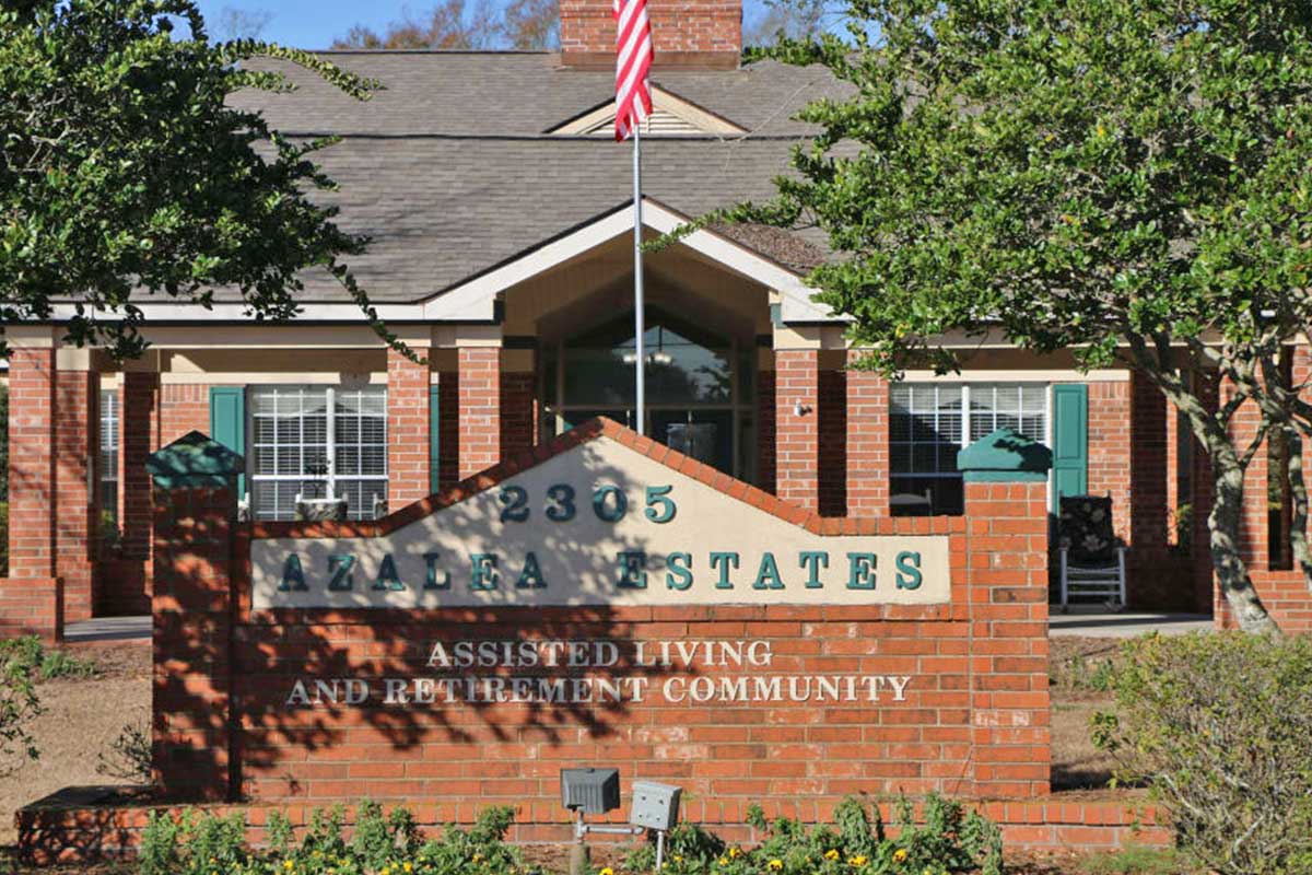 Exterior view of Azalea Estates building with sign