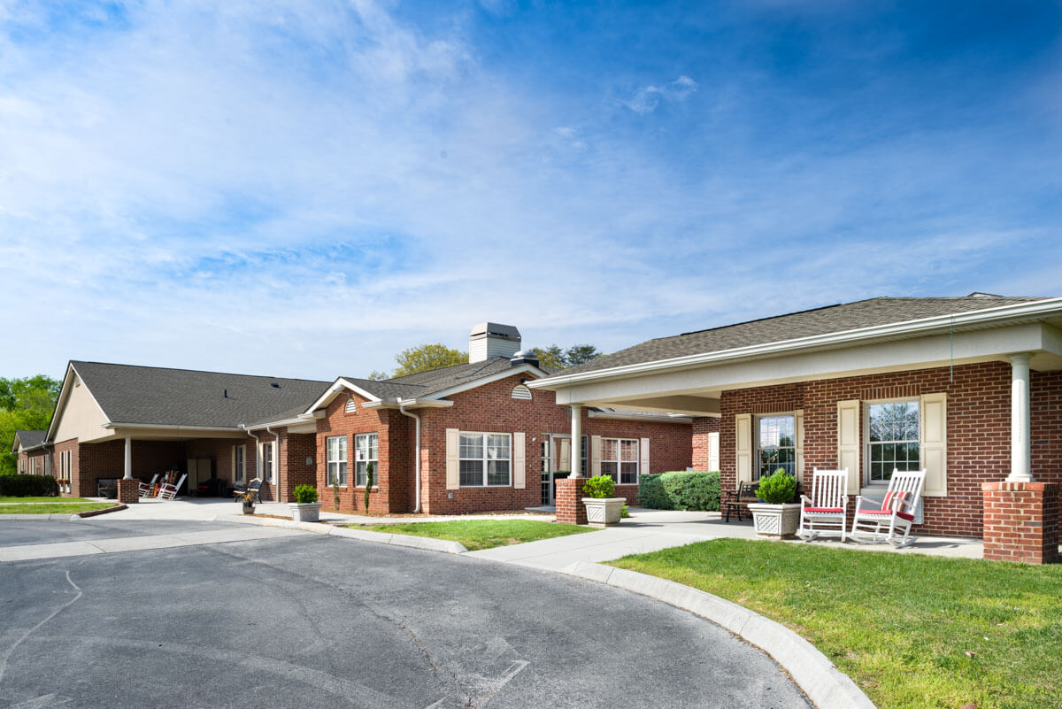 Exterior view of Azalea Estates with outdoor seating