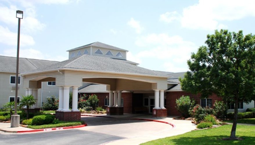 Entrance of Azalea Estates of Monroe with landscaped garden