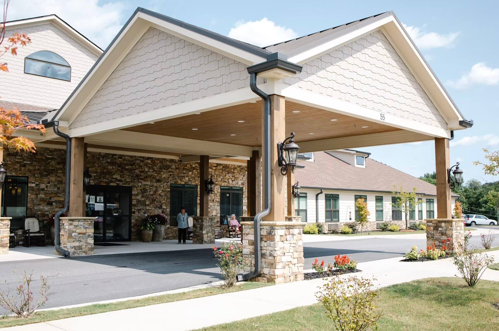 Exterior view of the facility entrance with residents