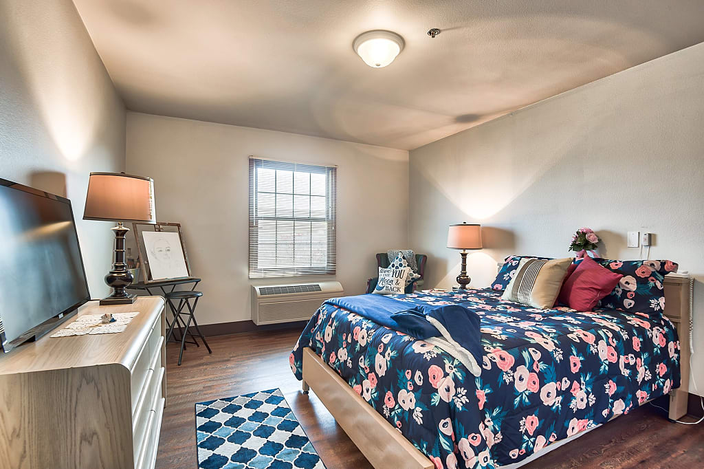 Cozy private resident room with floral bedding