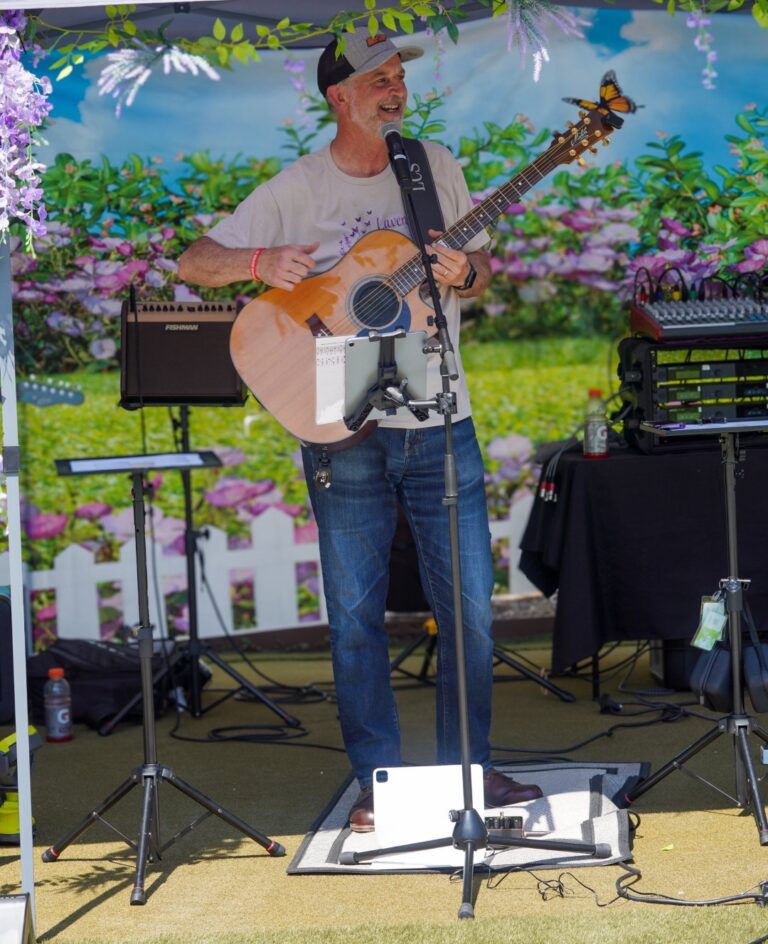 Musician performing outdoors at a community event