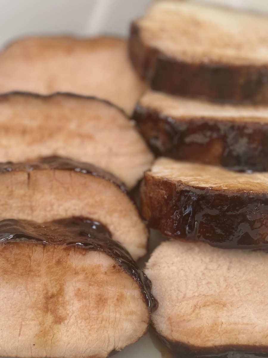 Sliced pork tenderloin served on a plate