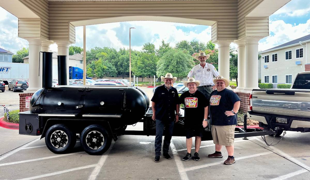 Residents celebrating a BBQ event in front of the facility
