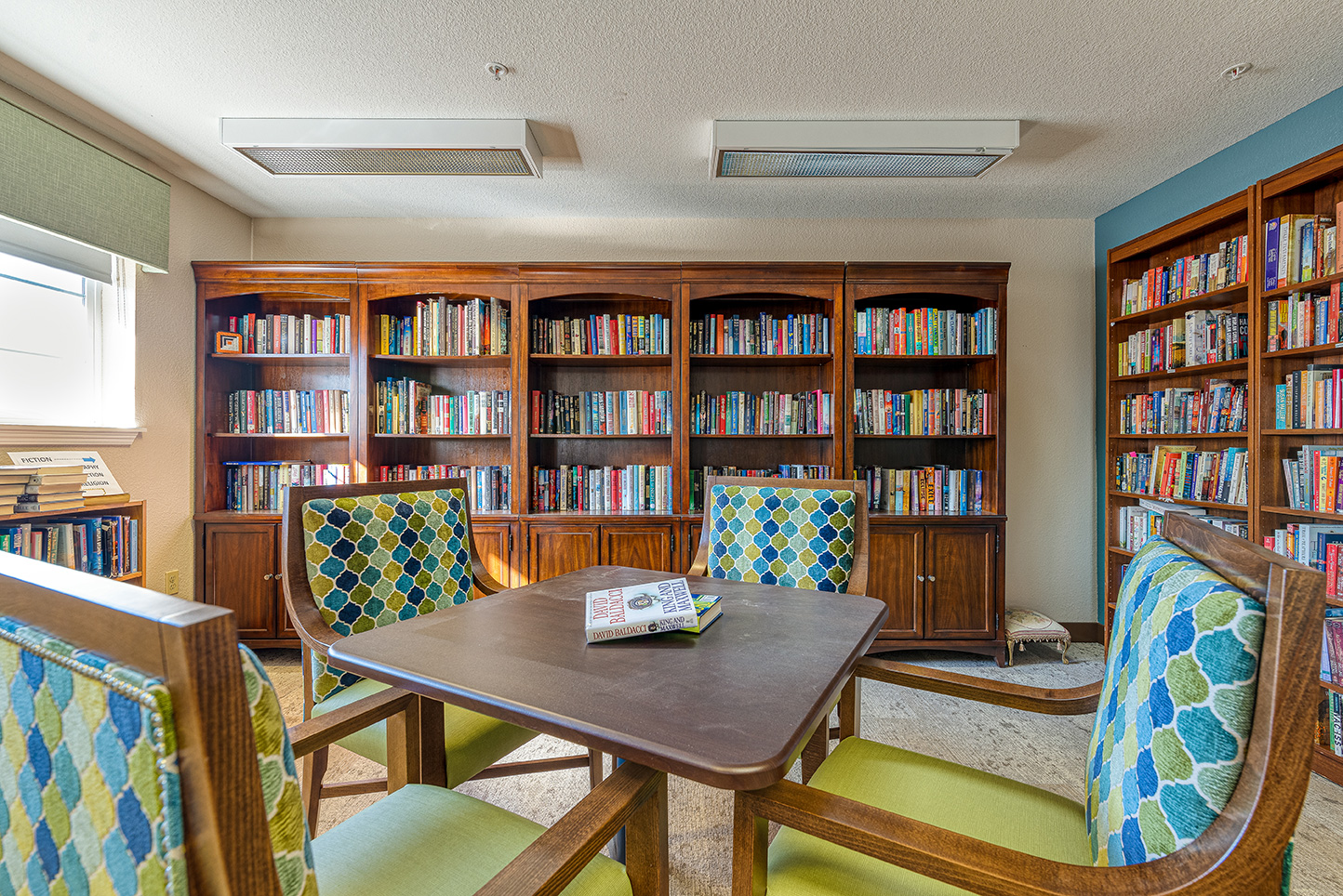 Cozy reading area in a library with bookshelves