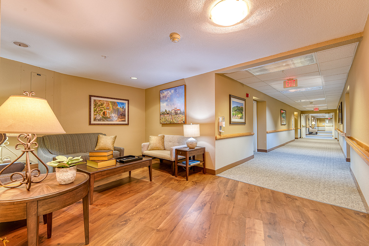 Interior hallway with seating area and artwork