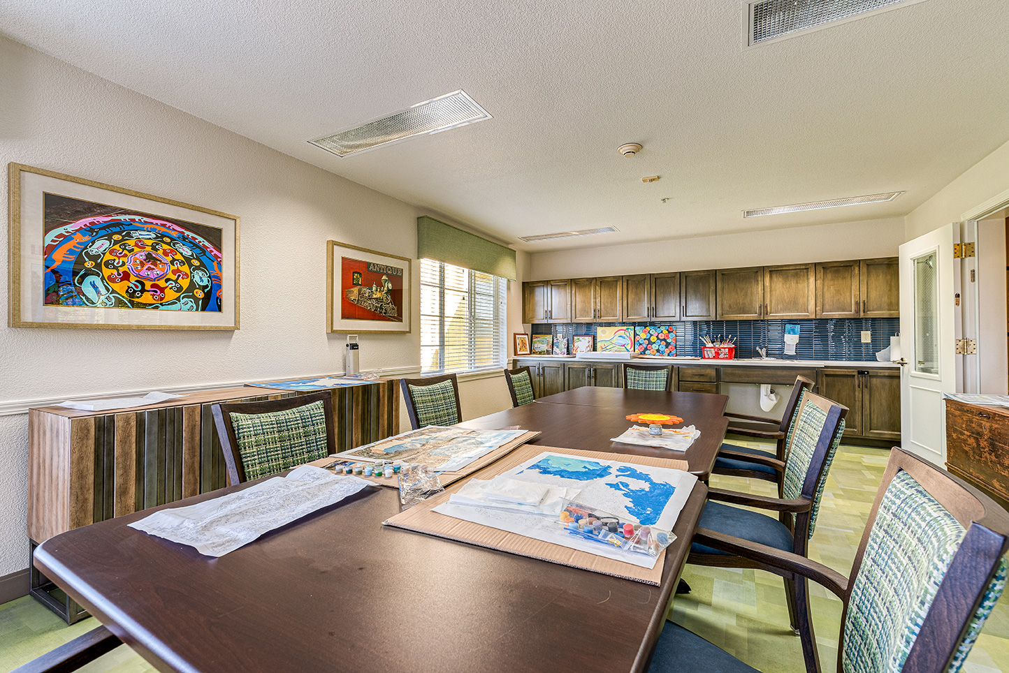 Activity room with tables and art supplies