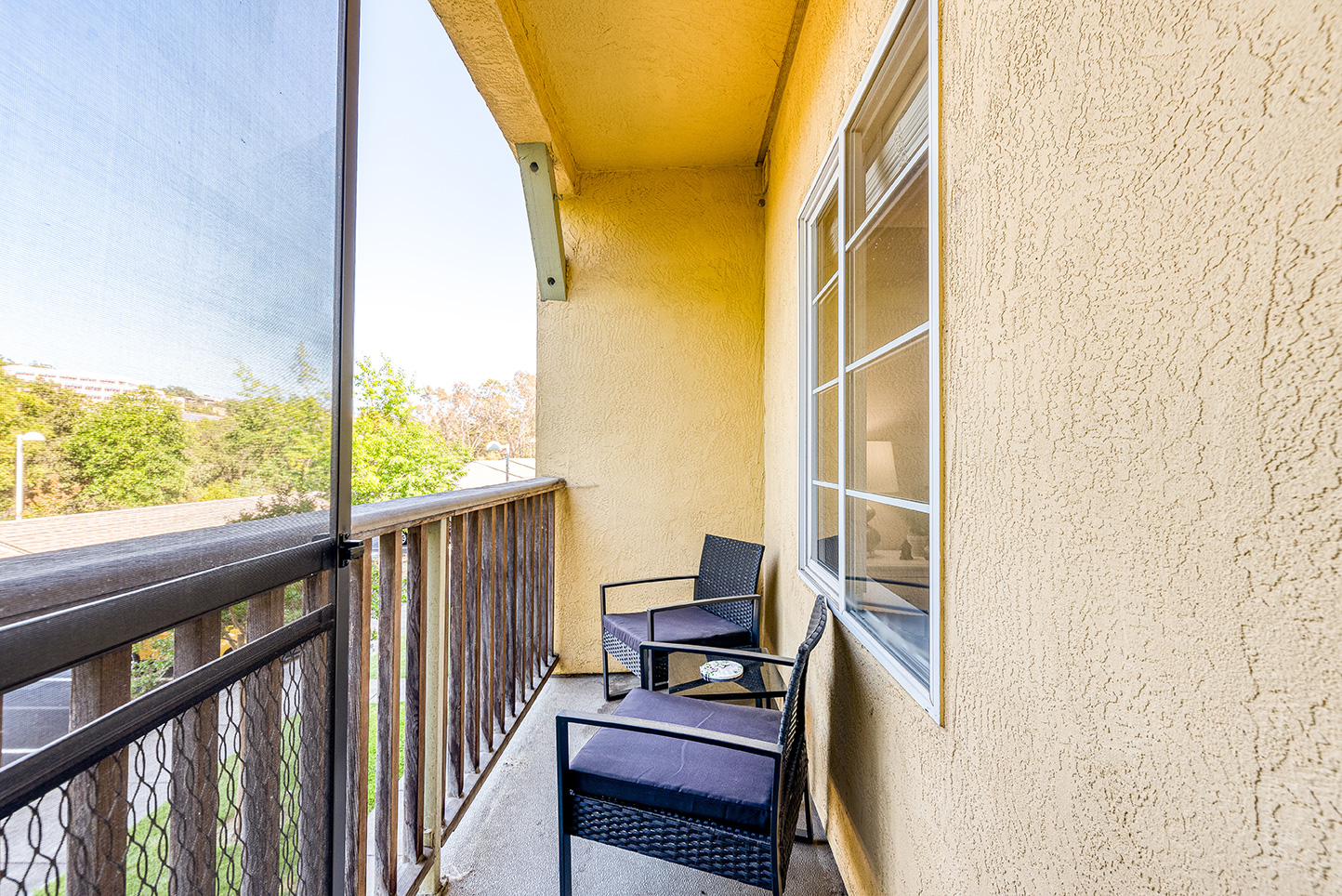 A cozy balcony with chairs at a senior living facility
