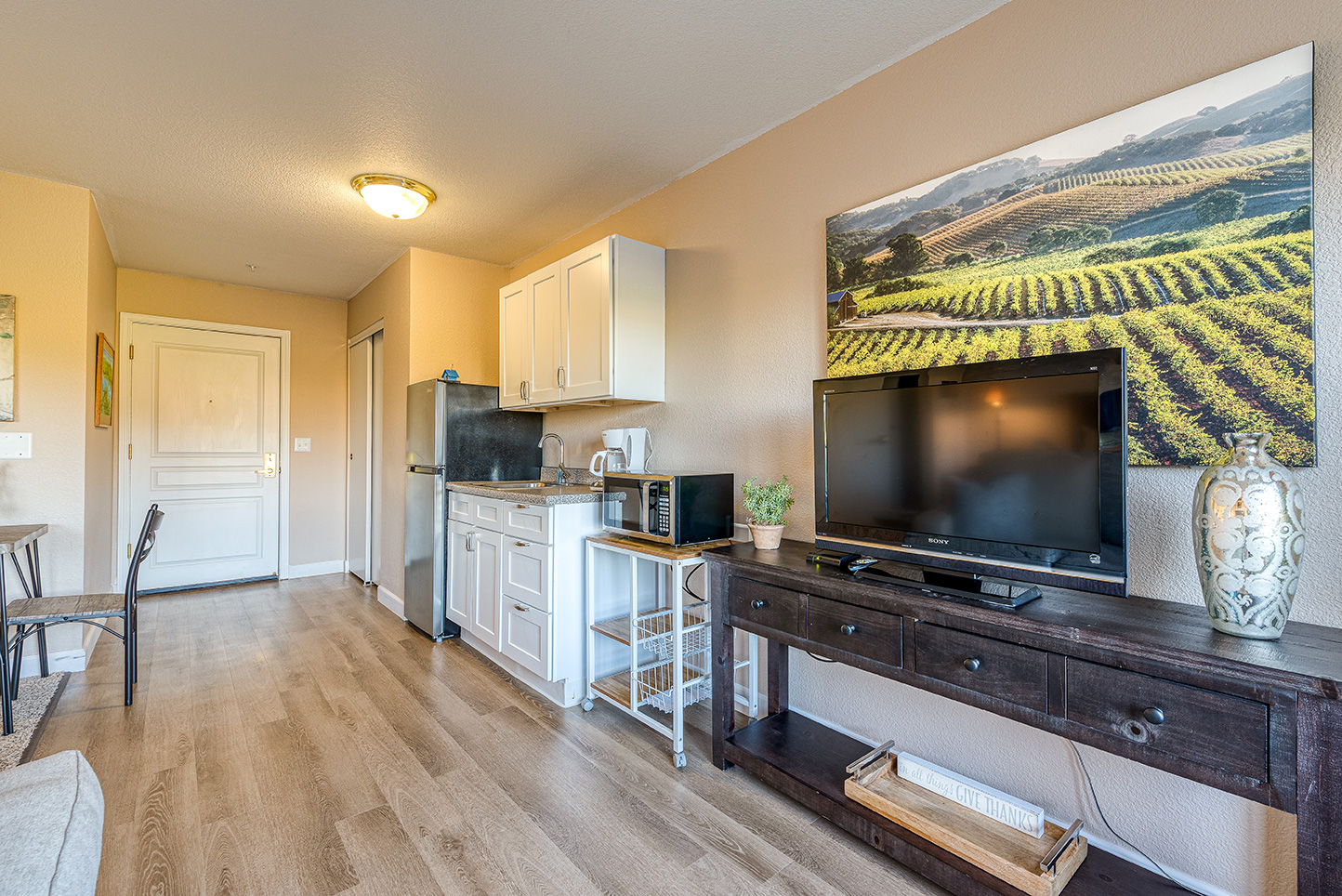 Bright interior of a resident room with kitchenette