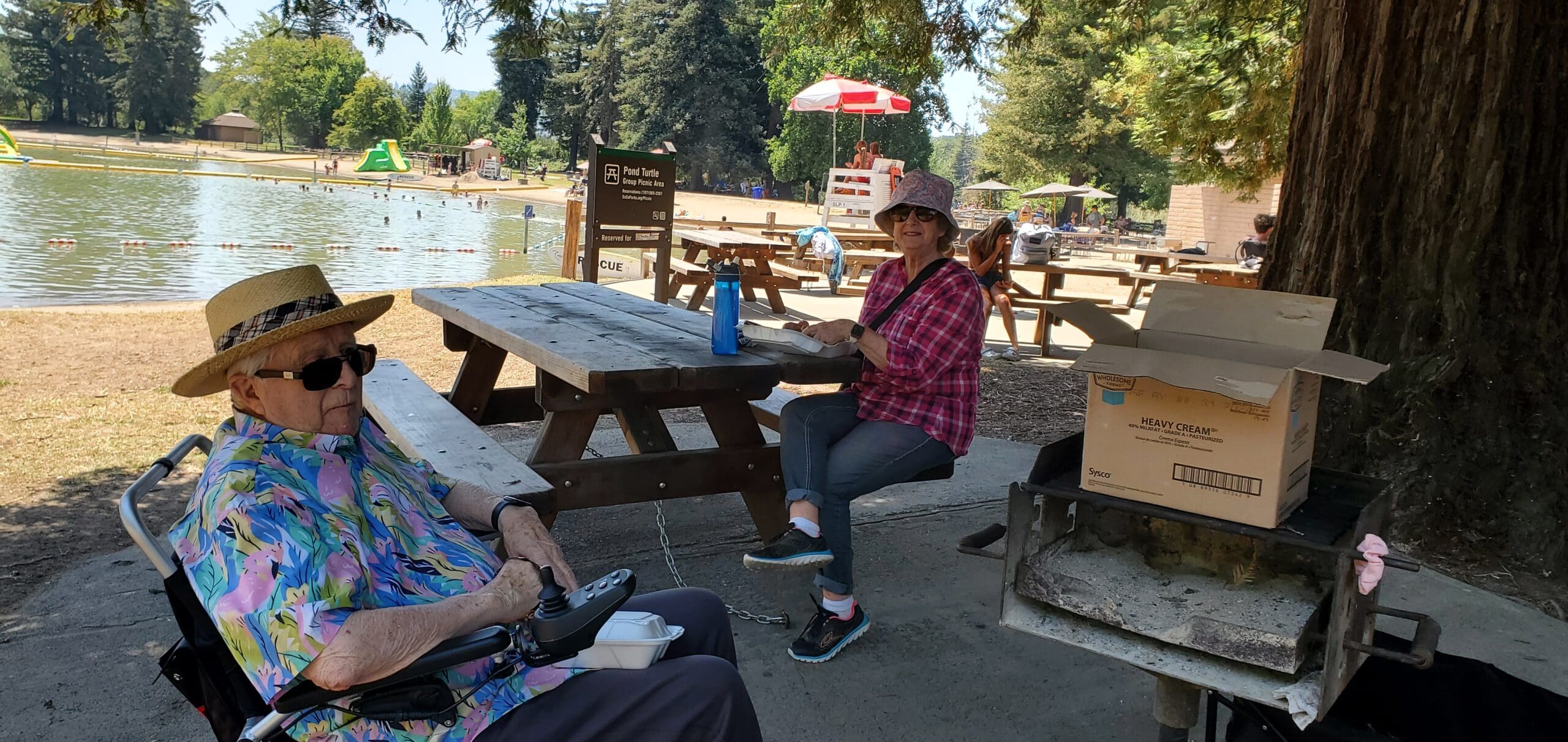 Residents enjoying a picnic by the lake.