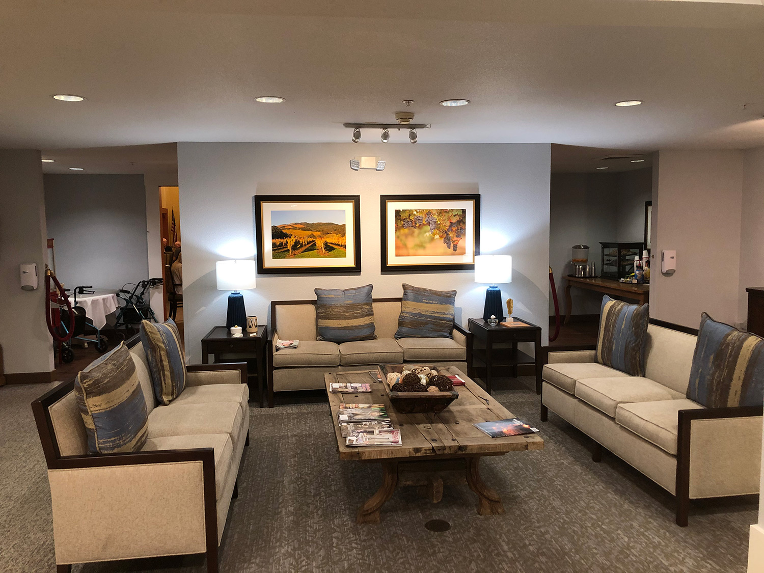 Cozy lounge area with seating and artwork