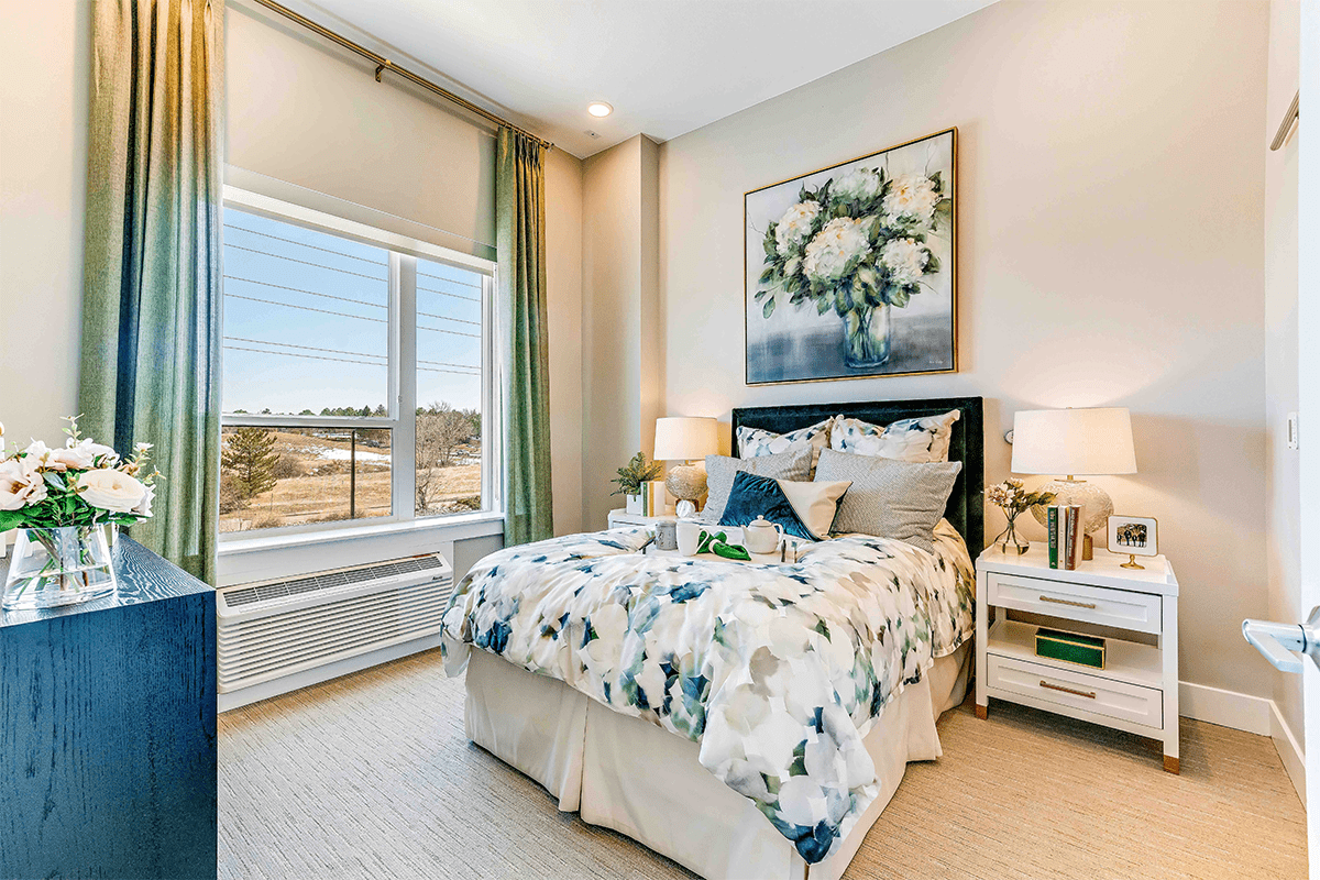 Cozy resident room with floral decor and natural light
