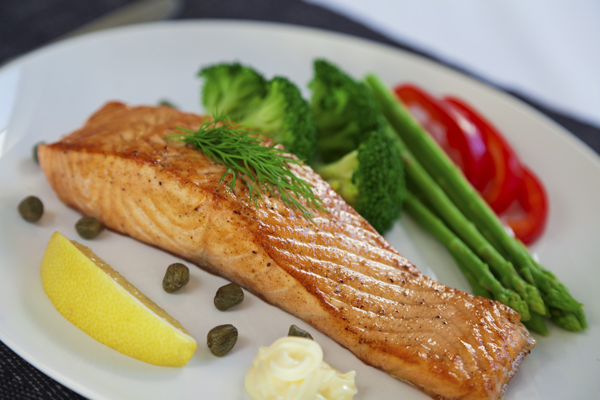 Plated meal of salmon with vegetables