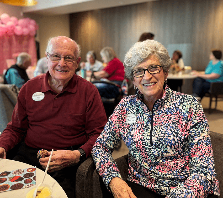 Two residents smiling in a common area