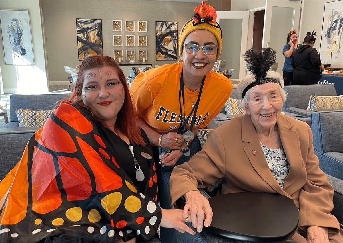 Residents and staff celebrating in a communal area