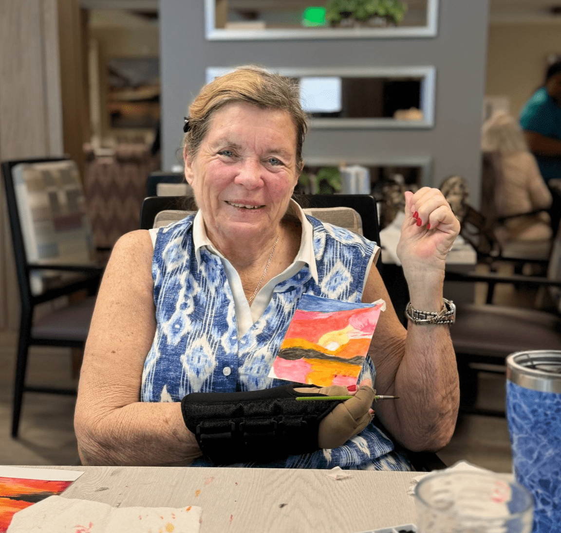 Resident engaging in an art activity in a common area