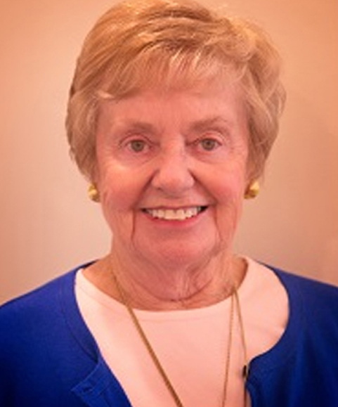 Smiling elderly woman in a blue cardigan