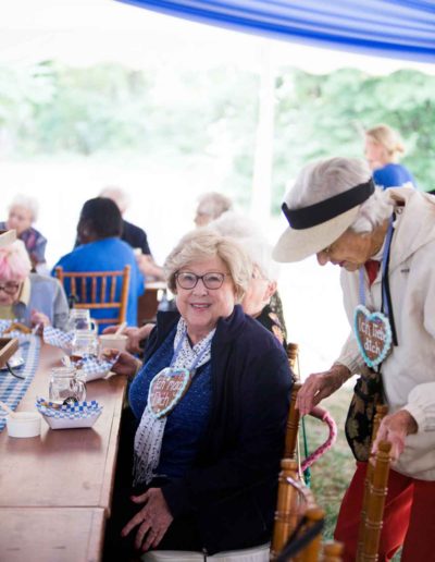 Residents enjoying a group activity under a tent