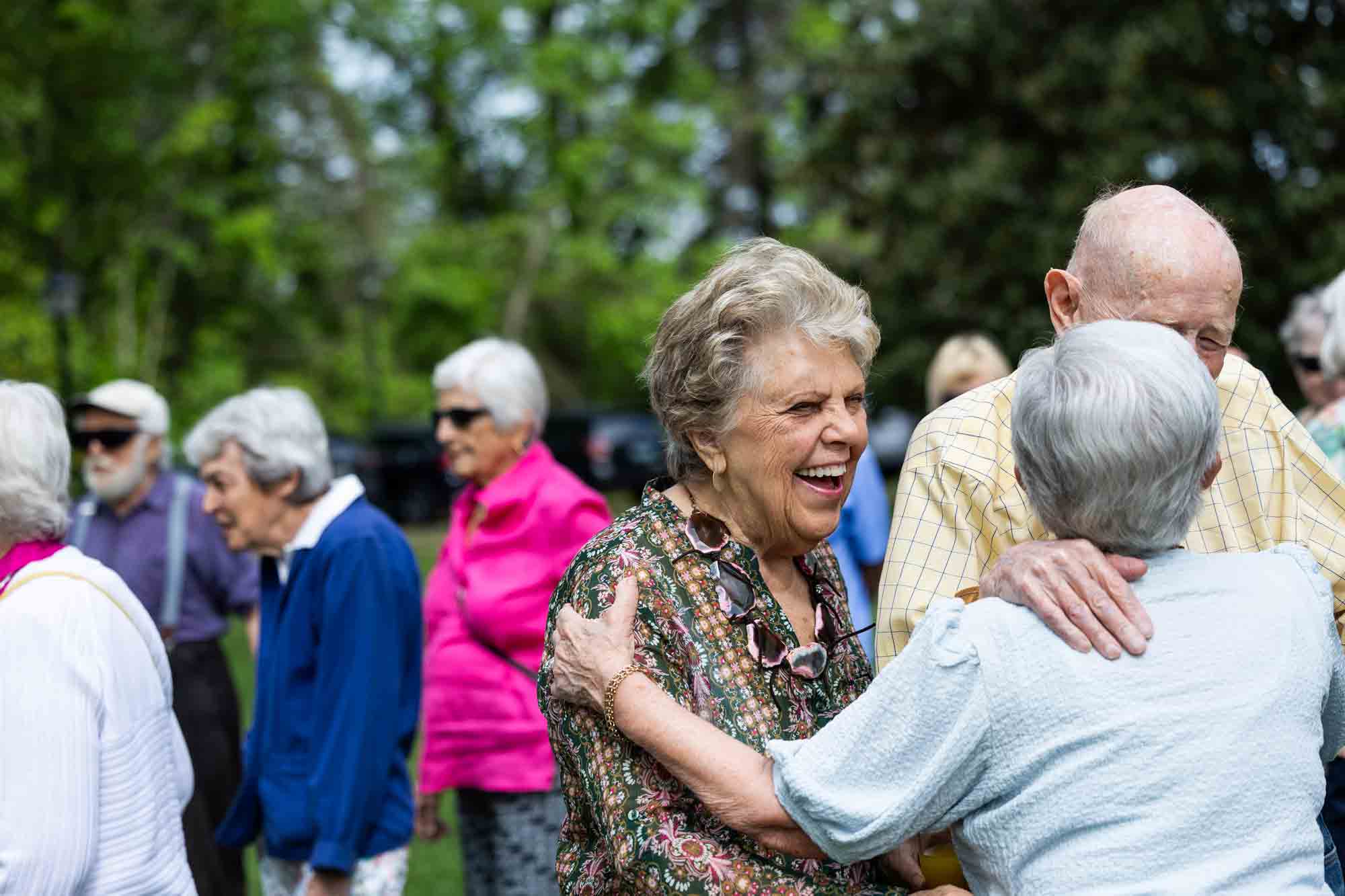 Residents enjoying a gathering outdoors at the facility