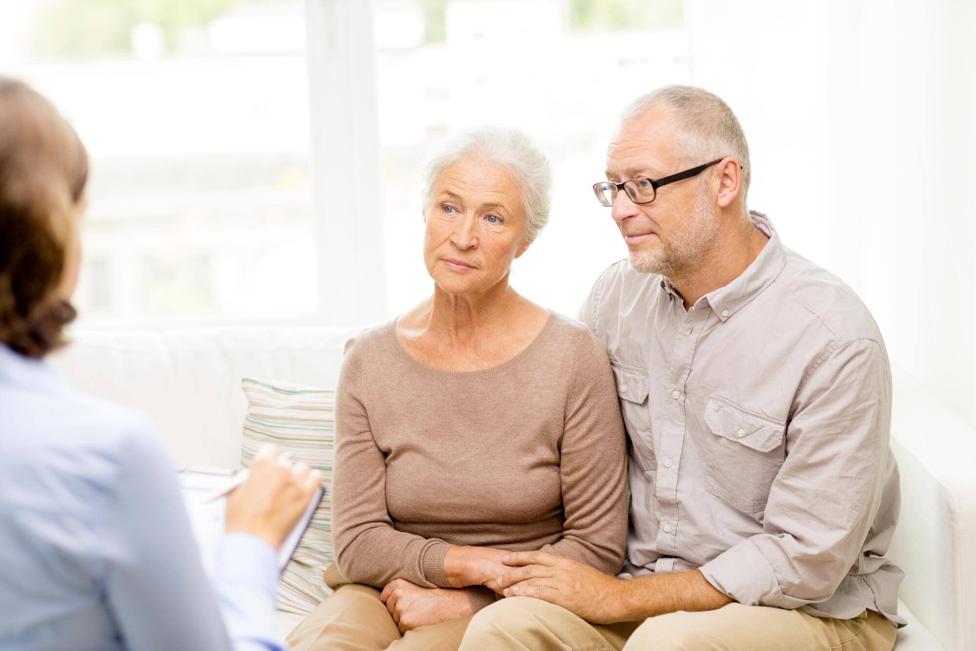 Couple consulting with a staff member in a cozy setting
