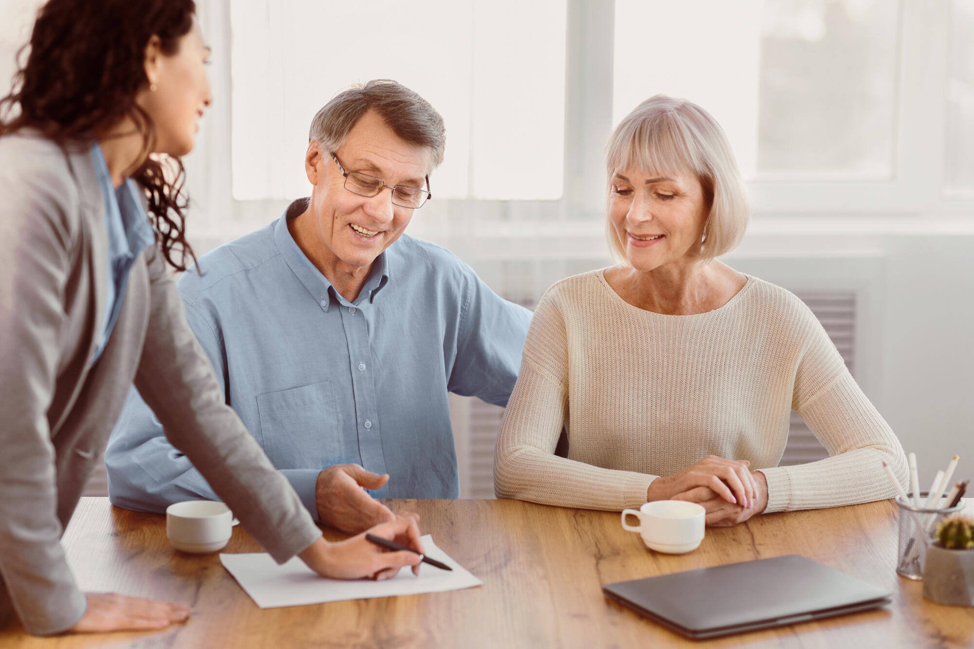 Residents and staff meeting at a table