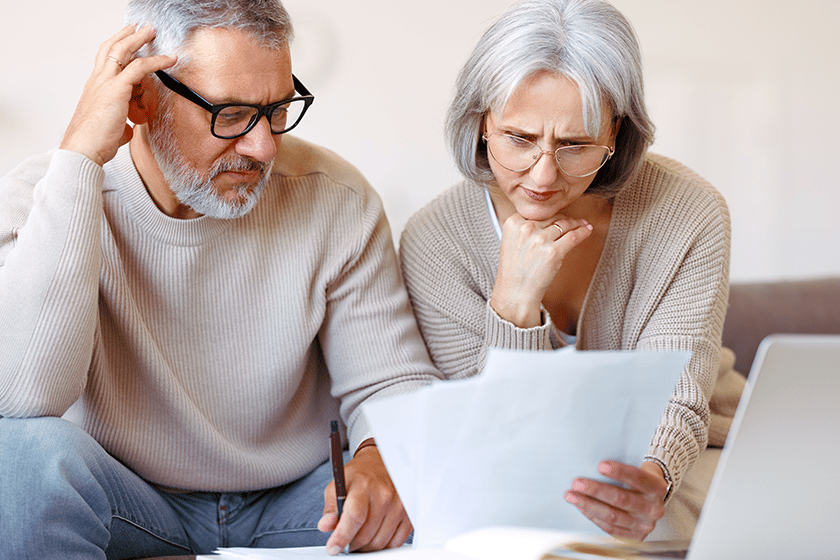 A senior couple reviewing documents together