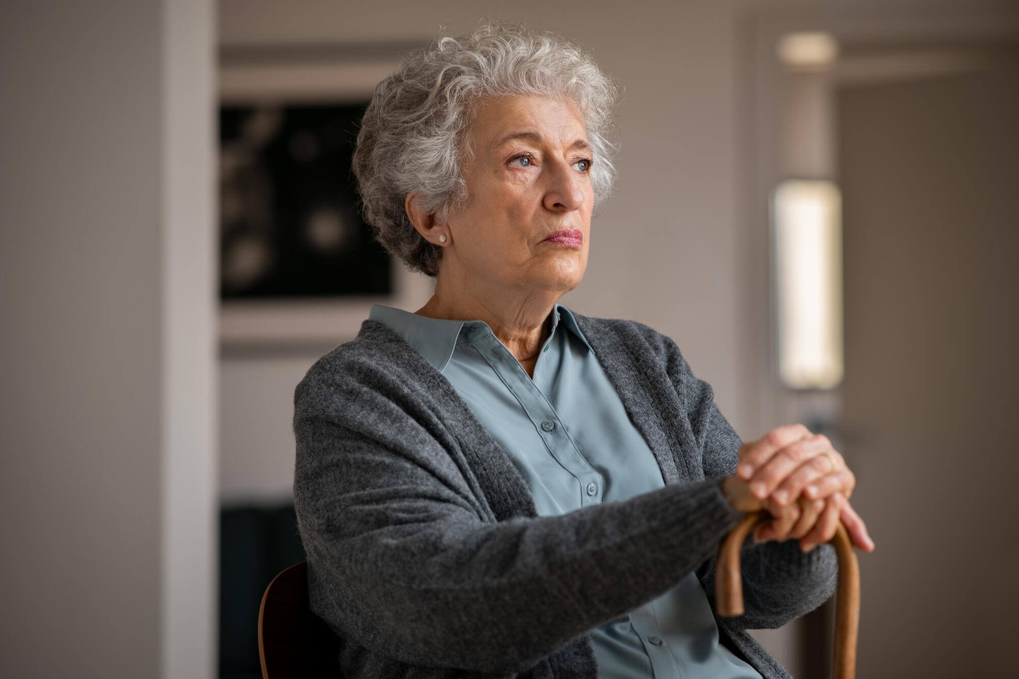 An elderly woman in a cozy living space