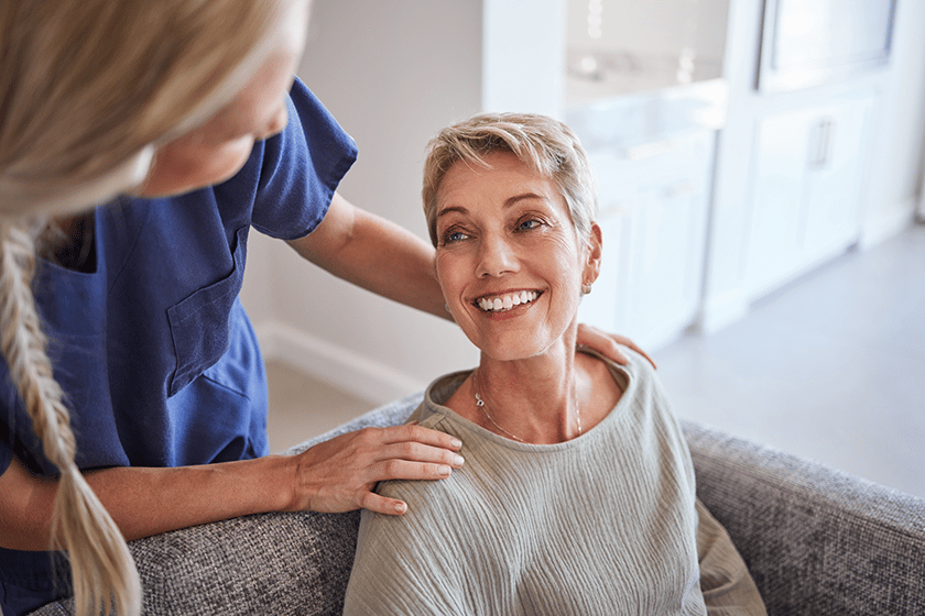 Caregiver interacting warmly with a resident