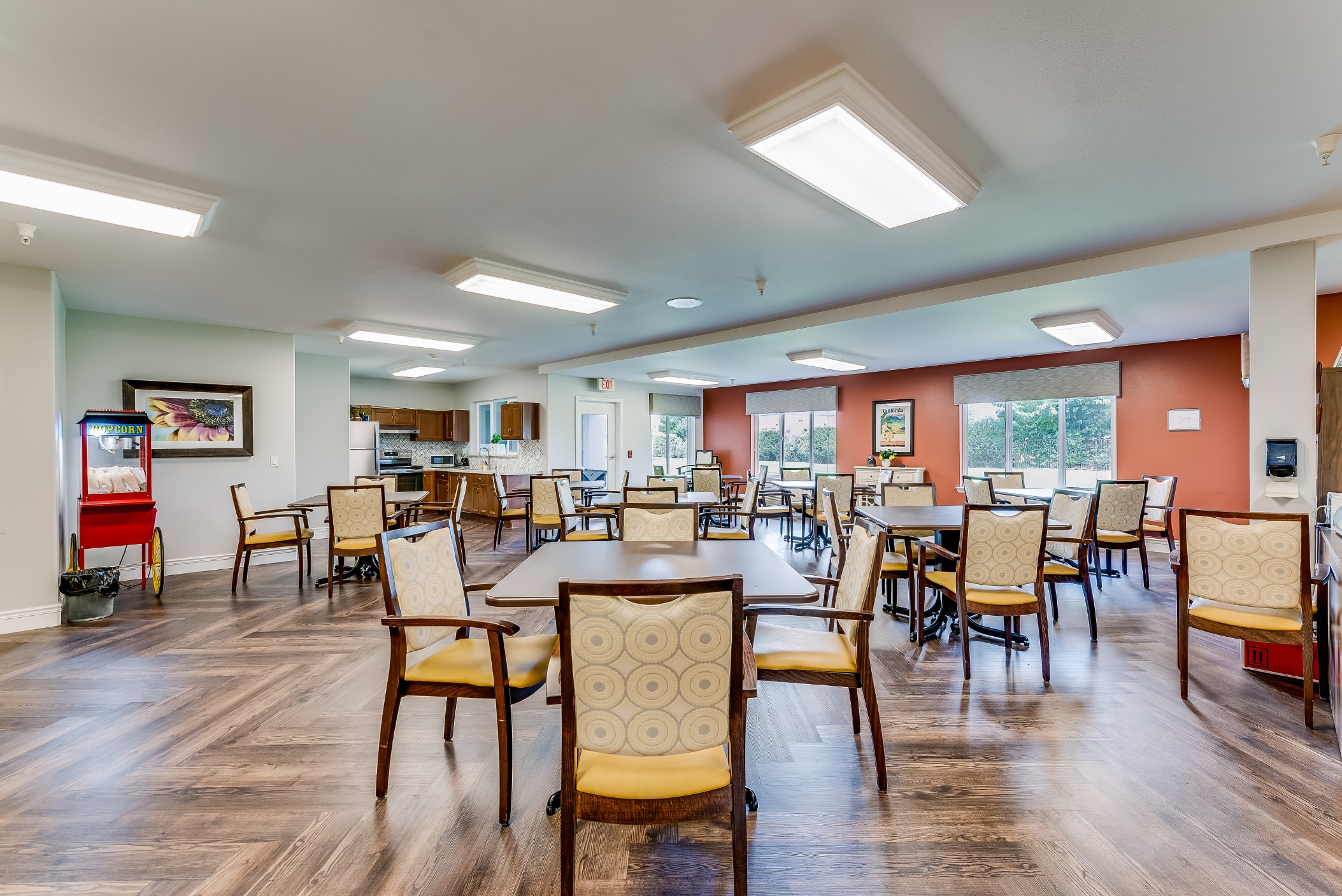Bright dining area with wooden tables and chairs