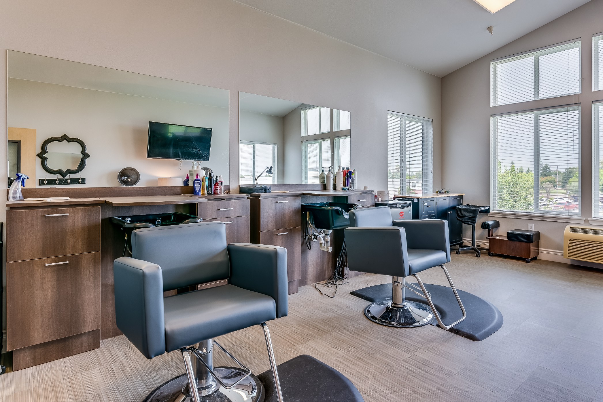 Interior of a hair salon with styling chairs and mirrors