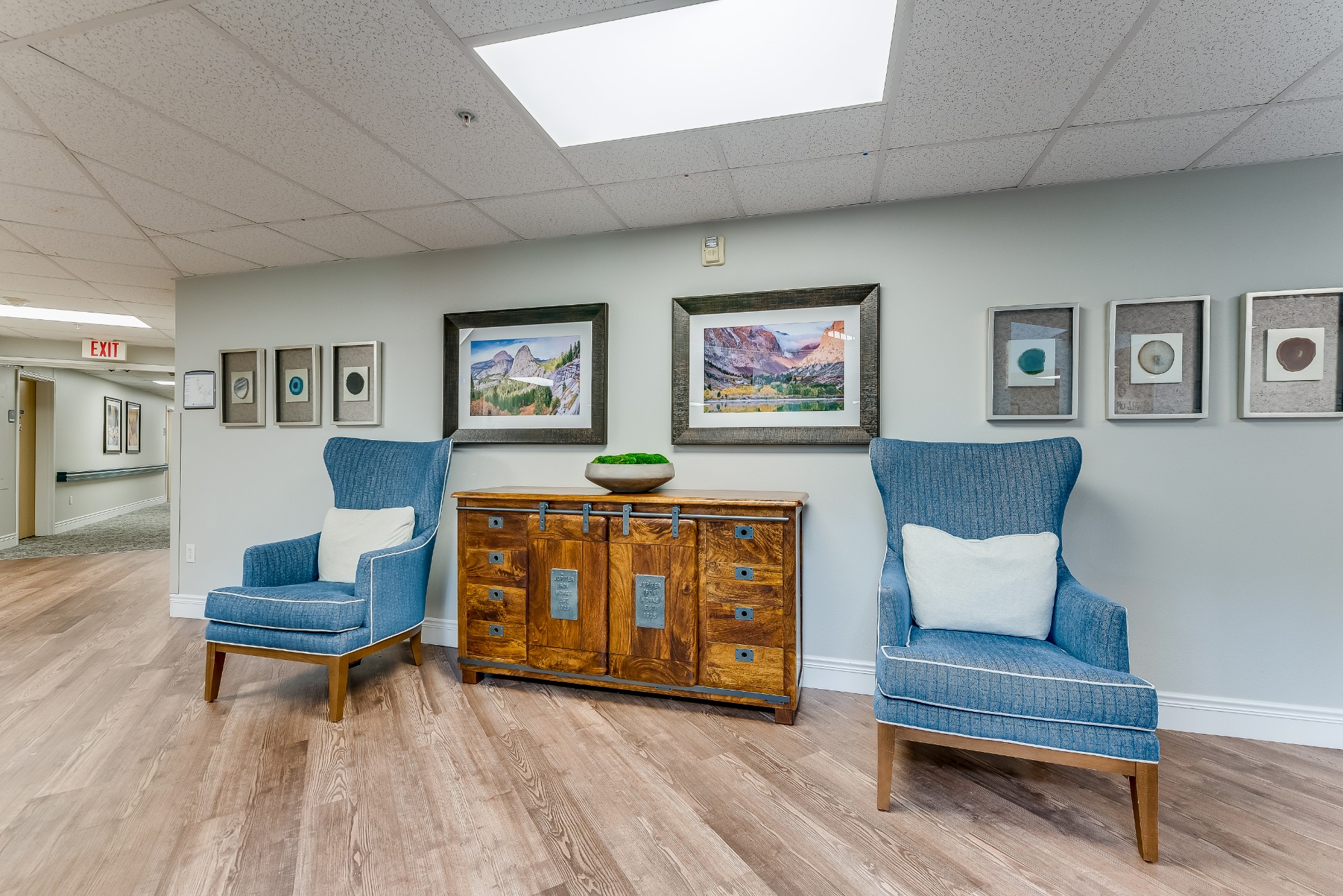 Interior view of a welcoming lobby area with chairs and art