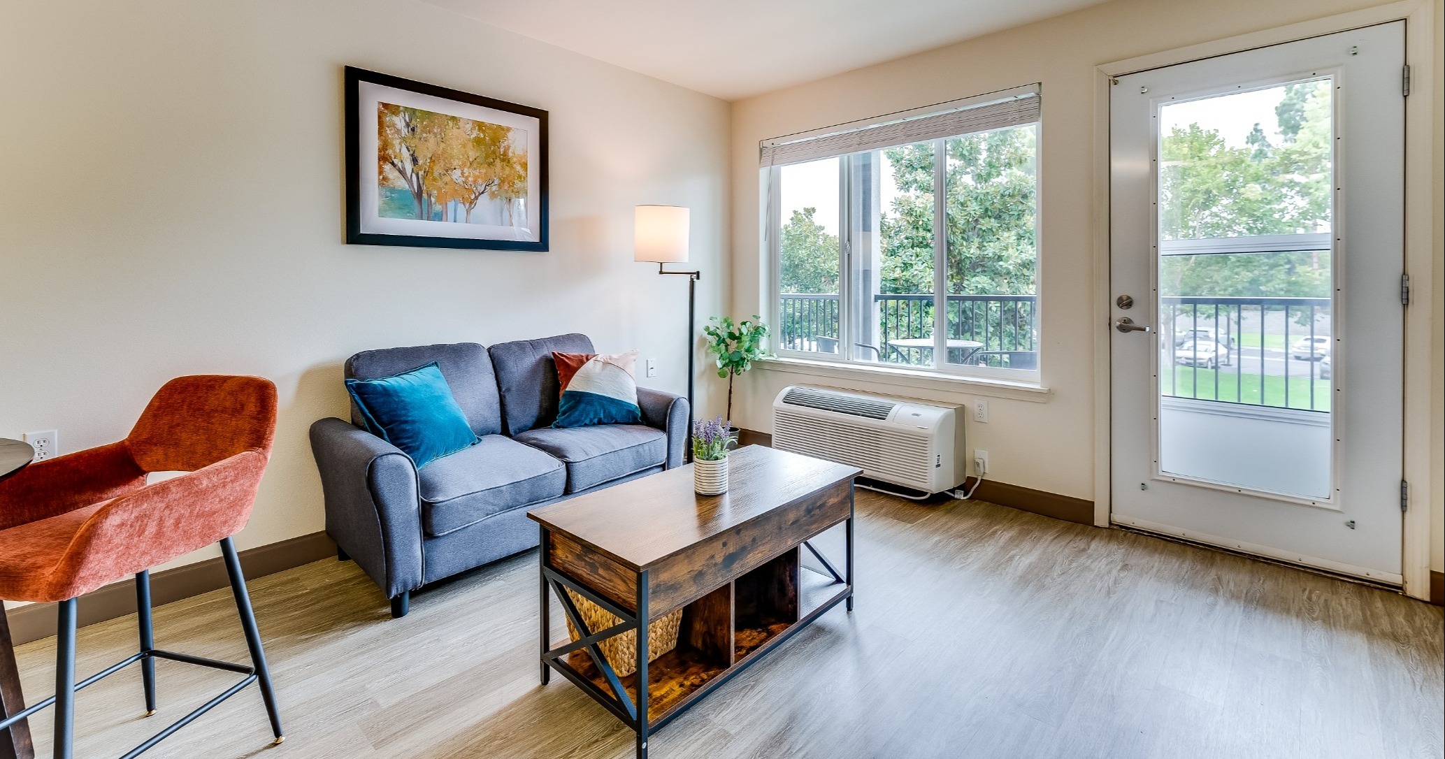 A cozy living room setup with a couch and natural light