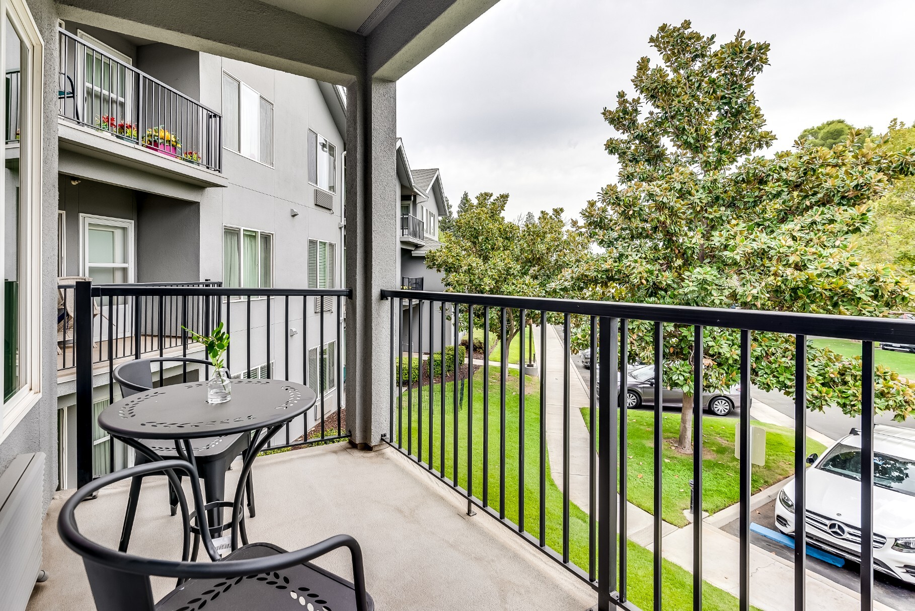 Balcony view of a senior living facility with outdoor space