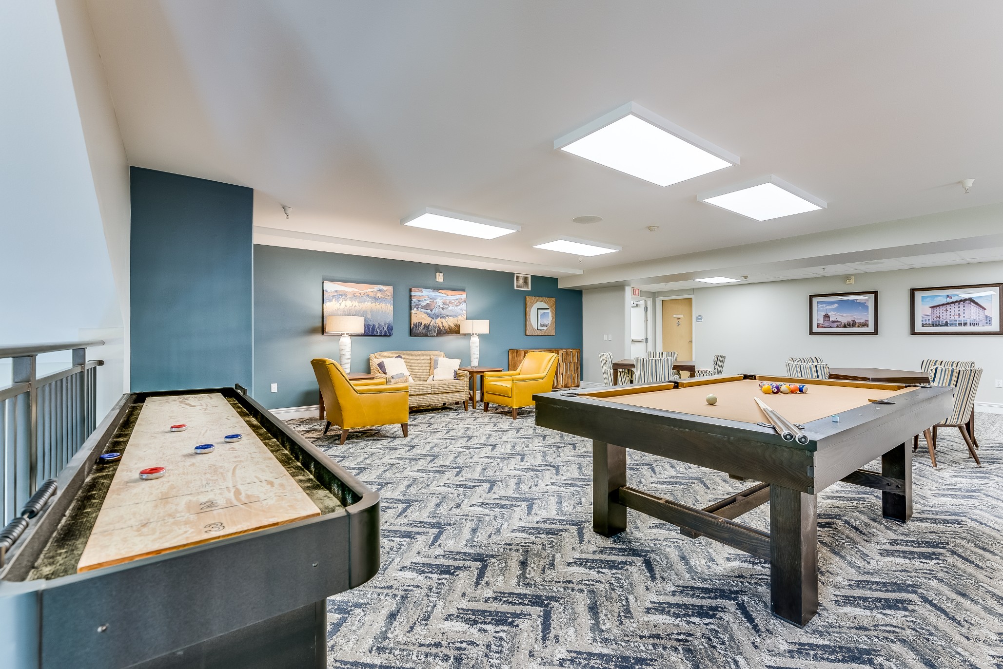 Common area with games and seating in a senior living facility