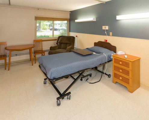Private resident room with bed and furniture